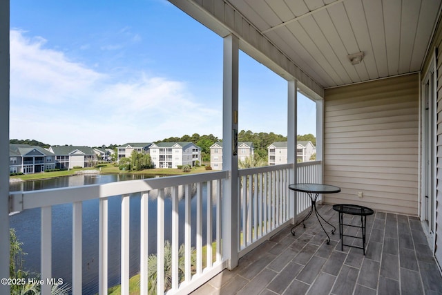 881 Great Egret Cir SW Unit 59E, Sunset Beach, NC 28468 - balcony with a residential view and a water view