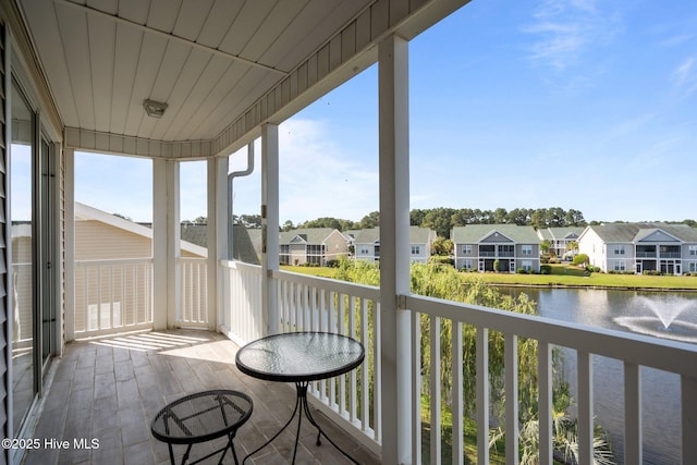 881 Great Egret Cir SW Unit 59E, Sunset Beach, NC 28468 - balcony featuring a residential view and a water view