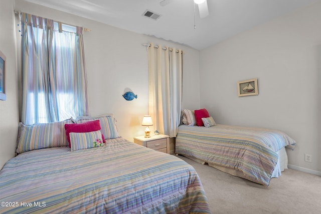 881 Great Egret Cir SW Unit 59E, Sunset Beach, NC 28468 - bedroom with light colored carpet, a ceiling fan, and baseboards