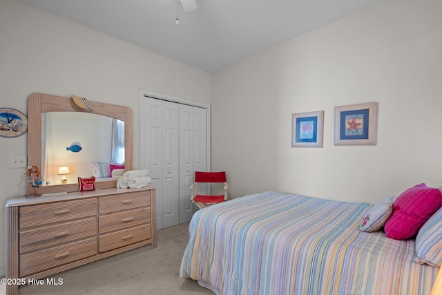 881 Great Egret Cir SW Unit 59E, Sunset Beach, NC 28468 - bedroom with light carpet, a closet, and ceiling fan