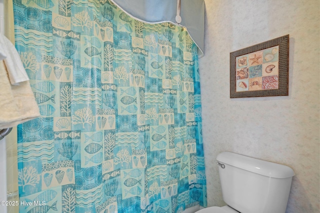 881 Great Egret Cir SW Unit 59E, Sunset Beach, NC 28468 - bathroom featuring toilet and curtained shower