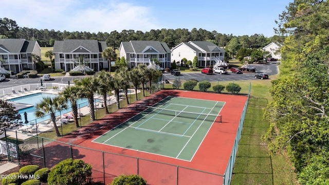 881 Great Egret Cir SW Unit 59E, Sunset Beach, NC 28468 - view of tennis court with fence and a residential view
