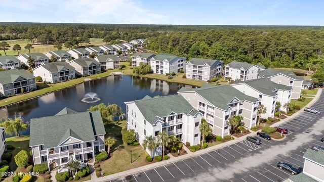 881 Great Egret Cir SW Unit 59E, Sunset Beach, NC 28468 - aerial view of a heavily wooded area and a nearby body of water