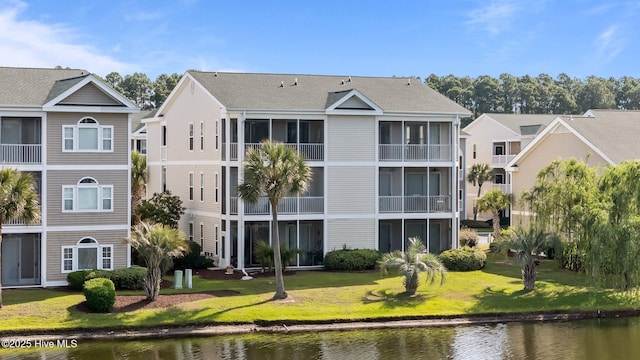 881 Great Egret Cir SW Unit 59E, Sunset Beach, NC 28468 - view of building exterior with a water view