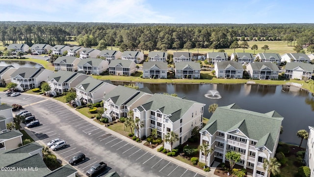 881 Great Egret Cir SW Unit 59E, Sunset Beach, NC 28468 - aerial view of residential area with a large body of water and a heavily wooded area