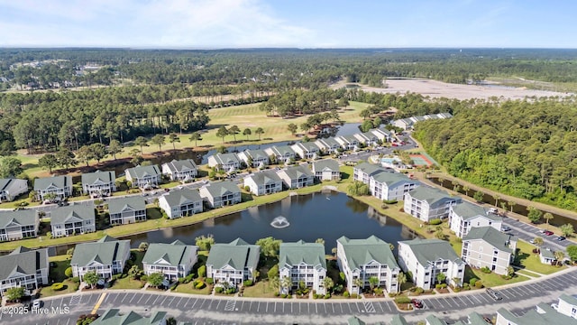881 Great Egret Cir SW Unit 59E, Sunset Beach, NC 28468 - view of property location with a heavily wooded area, a nearby body of water, and nearby suburban area