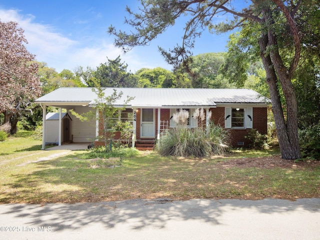 204 Cedar St, Emerald Isle, NC 28594 - single story home featuring a shed, a carport, metal roof, and an outdoor structure