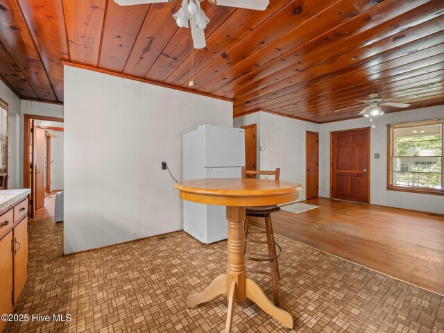204 Cedar St, Emerald Isle, NC 28594 - dining space with a ceiling fan and wood ceiling