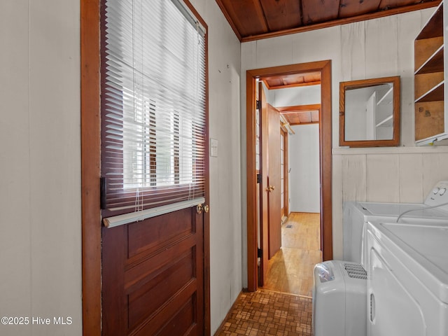 204 Cedar St, Emerald Isle, NC 28594 - laundry room with independent washer and dryer and wood walls