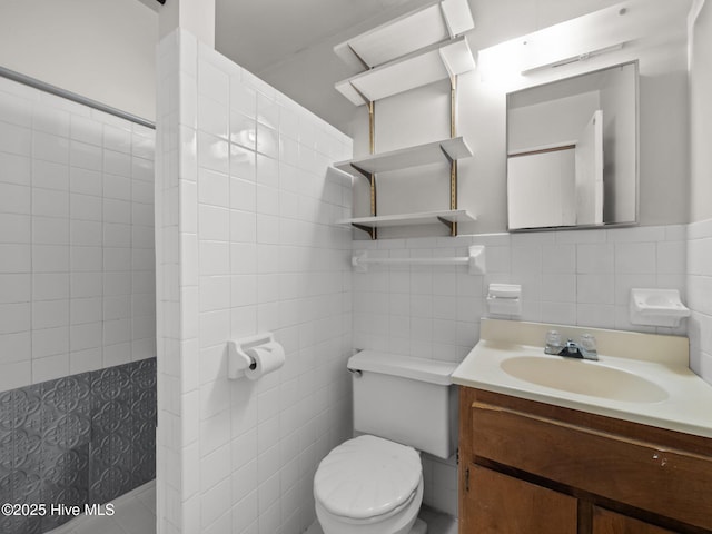 204 Cedar St, Emerald Isle, NC 28594 - full bath featuring tile walls, toilet, vanity, wainscoting, and a tile shower