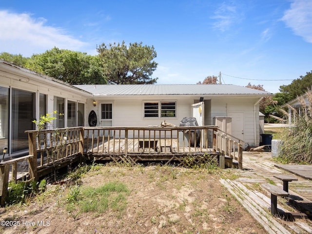 204 Cedar St, Emerald Isle, NC 28594 - rear view of house with metal roof and a deck