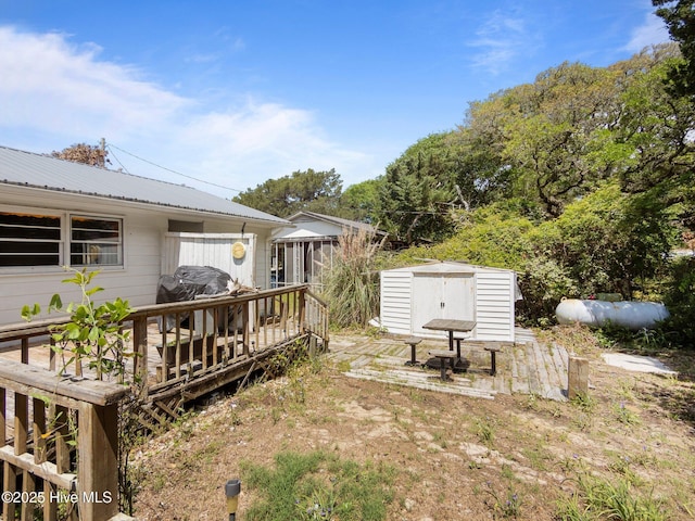 204 Cedar St, Emerald Isle, NC 28594 - view of yard with a storage shed, a wooden deck, and an outbuilding
