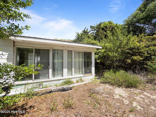 204 Cedar St, Emerald Isle, NC 28594 - view of home's exterior featuring a sunroom