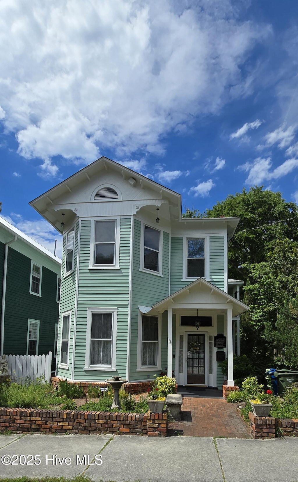 view of front of home featuring fence