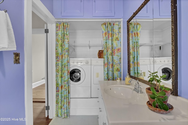 211 Ann St, Wilmington, NC 28401 - bathroom featuring washing machine and clothes dryer and vanity