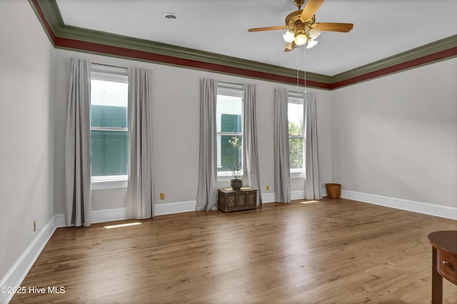 211 Ann St, Wilmington, NC 28401 - empty room with a ceiling fan, ornamental molding, wood finished floors, and baseboards