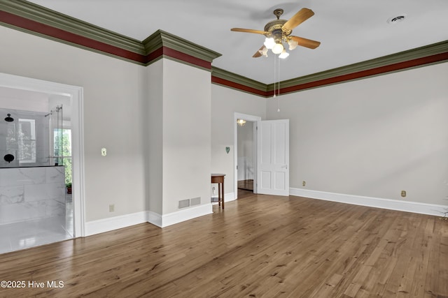 211 Ann St, Wilmington, NC 28401 - spare room featuring a ceiling fan, wood finished floors, baseboards, and crown molding