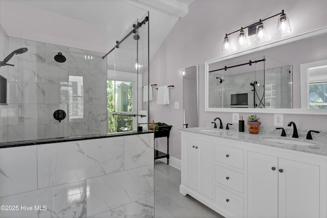 211 Ann St, Wilmington, NC 28401 - bathroom with tiled shower, lofted ceiling, marble look tiles, double vanity, and baseboards