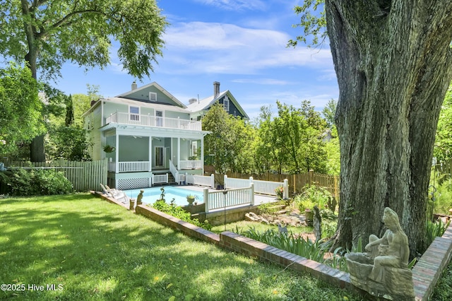 211 Ann St, Wilmington, NC 28401 - back of house featuring a sunroom and a balcony