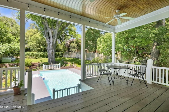 211 Ann St, Wilmington, NC 28401 - deck with ceiling fan, outdoor dining area, a fenced backyard, and view of wooded area