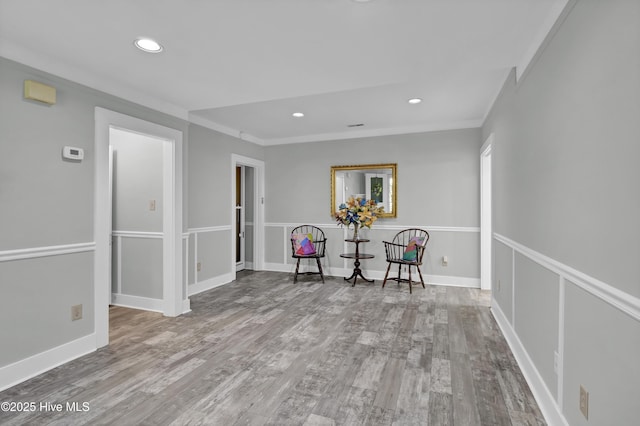 211 Ann St, Wilmington, NC 28401 - sitting room with wood finished floors, ornamental molding, and recessed lighting