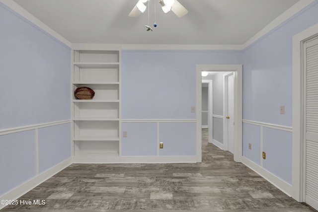 211 Ann St, Wilmington, NC 28401 - unfurnished bedroom featuring wood finished floors, a ceiling fan, and baseboards