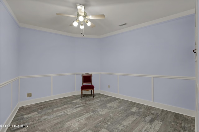 211 Ann St, Wilmington, NC 28401 - unfurnished room featuring wood finished floors, ceiling fan, and crown molding