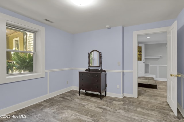 211 Ann St, Wilmington, NC 28401 - bedroom with wood finished floors and baseboards