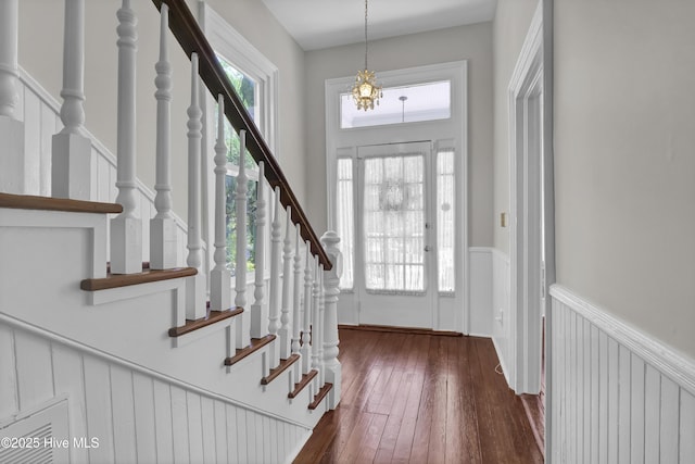 211 Ann St, Wilmington, NC 28401 - entryway featuring stairs, dark wood-style floors, and wainscoting