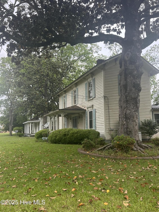 view of home's exterior with a yard