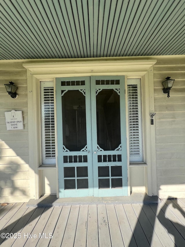 doorway to property with french doors and a deck