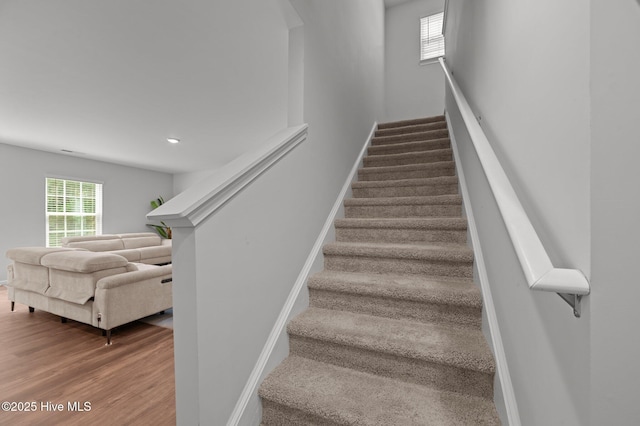 4569 Sandstone Dr, Greenville, NC 27858 - staircase featuring baseboards, wood finished floors, and recessed lighting