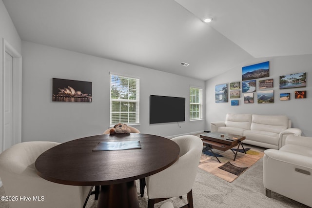 4569 Sandstone Dr, Greenville, NC 27858 - living room featuring lofted ceiling, healthy amount of natural light, and light colored carpet