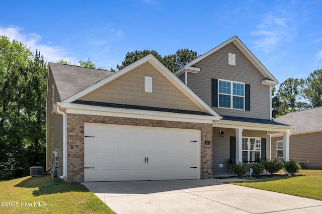 4569 Sandstone Dr, Greenville, NC 27858 - view of front of house with a garage, driveway, cooling unit, a front yard, and covered porch