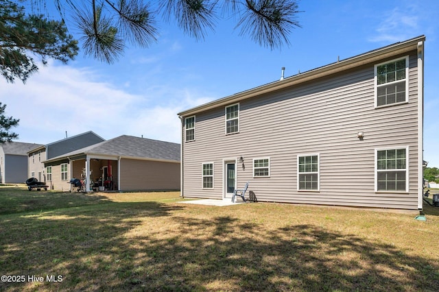 4569 Sandstone Dr, Greenville, NC 27858 - back of house with a lawn and a patio area