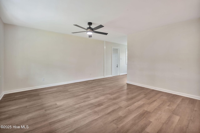 304 S Thompson St, Whiteville, NC 28472 - empty room with a ceiling fan, wood finished floors, and baseboards