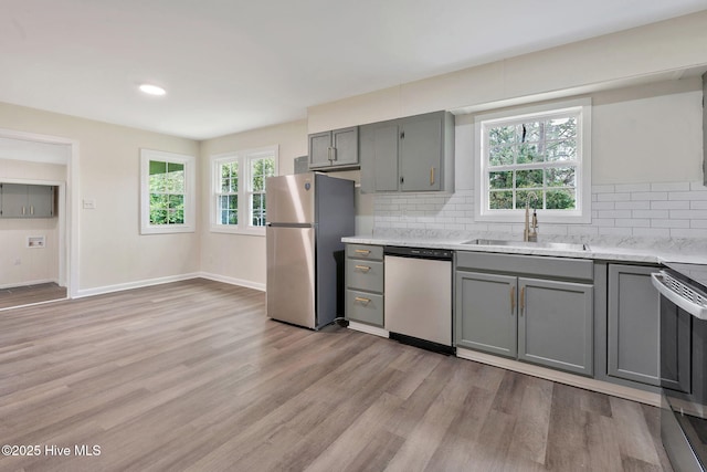 304 S Thompson St, Whiteville, NC 28472 - kitchen with stainless steel appliances, gray cabinets, a sink, decorative backsplash, and recessed lighting
