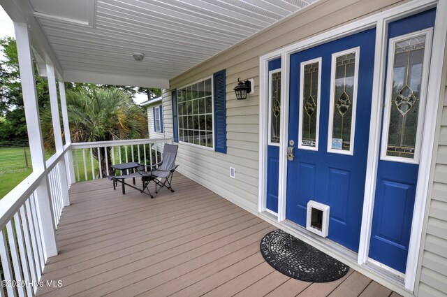 2046 Ash Little River Rd NW, Ash, NC 28420 - wooden deck with a porch