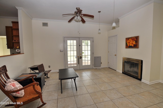 2046 Ash Little River Rd NW, Ash, NC 28420 - living area with a ceiling fan, ornamental molding, french doors, light tile patterned floors, and a glass covered fireplace