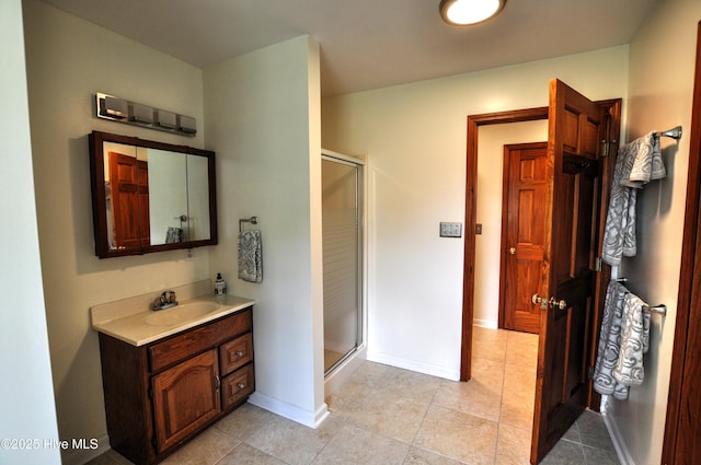 2046 Ash Little River Rd NW, Ash, NC 28420 - bathroom featuring a stall shower, tile patterned floors, vanity, and baseboards