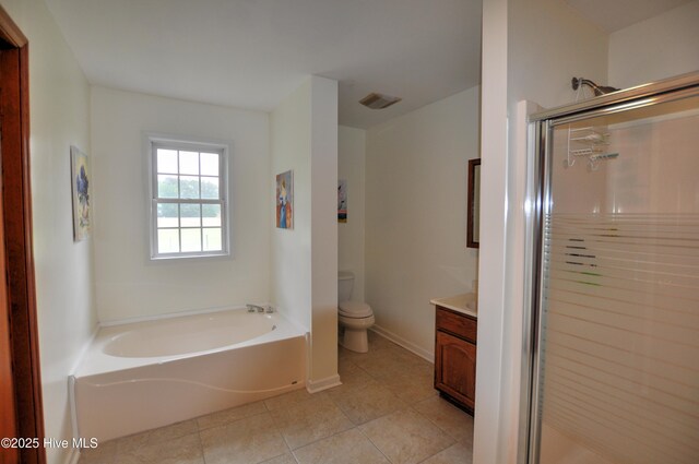 2046 Ash Little River Rd NW, Ash, NC 28420 - full bathroom with a shower stall, vanity, toilet, tile patterned floors, and a garden tub