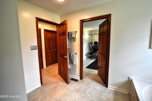 2046 Ash Little River Rd NW, Ash, NC 28420 - hall featuring baseboards and light tile patterned flooring