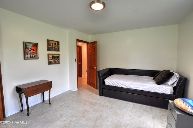 2046 Ash Little River Rd NW, Ash, NC 28420 - bedroom with light tile patterned floors and baseboards