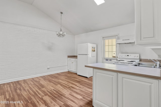 1119 Park St 1117, Elizabeth City, NC 27909 - kitchen featuring white appliances, a sink, under cabinet range hood, brick wall, and white cabinets