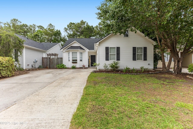 single story home featuring concrete driveway