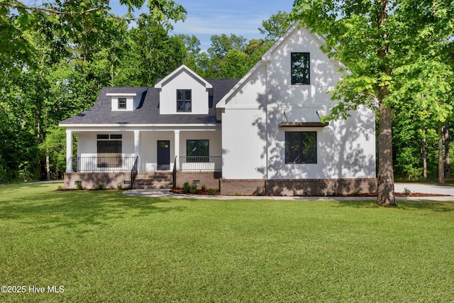 140 E Ag Dr, New Bern, NC 28562 - view of front facade featuring covered porch, a front yard, roof with shingles, and brick siding