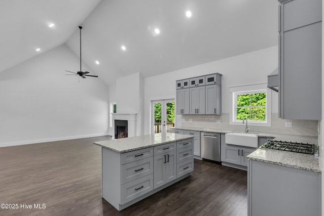 140 E Ag Dr, New Bern, NC 28562 - kitchen with a sink, gray cabinets, stainless steel appliances, high vaulted ceiling, and backsplash