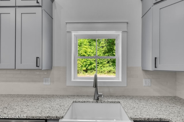 140 E Ag Dr, New Bern, NC 28562 - kitchen featuring a sink, backsplash, light stone counters, and dishwashing machine