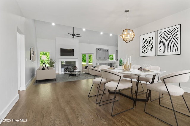 140 E Ag Dr, New Bern, NC 28562 - dining space featuring a chandelier, a fireplace, baseboards, dark wood-style flooring, and ceiling fan