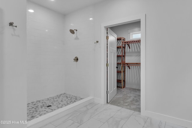 140 E Ag Dr, New Bern, NC 28562 - bathroom featuring a stall shower, marble finish floors, a walk in closet, and baseboards